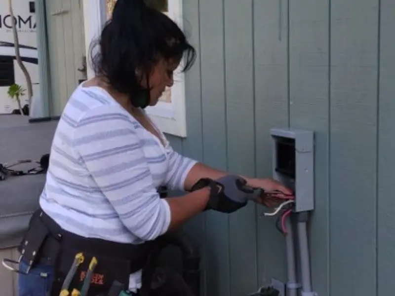 Licensed electrician wiring an exterior subpanel in Combee Settlement